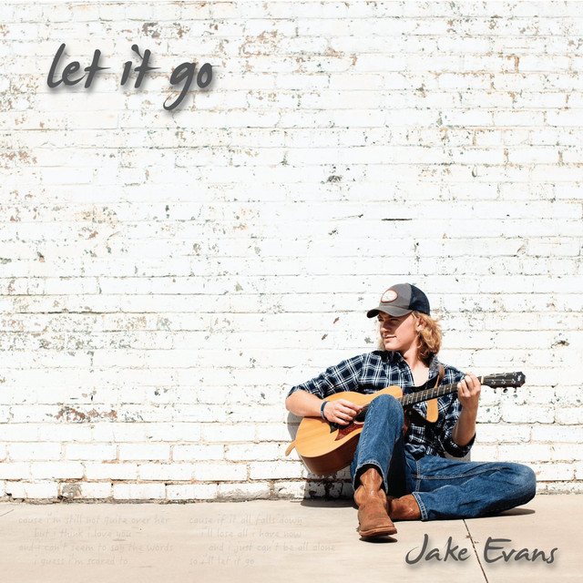 Let It Go single artwork: Jake Evans seated against a white-painted brick wall with an acoustic guitar, handwritten title and lyric fragments.
